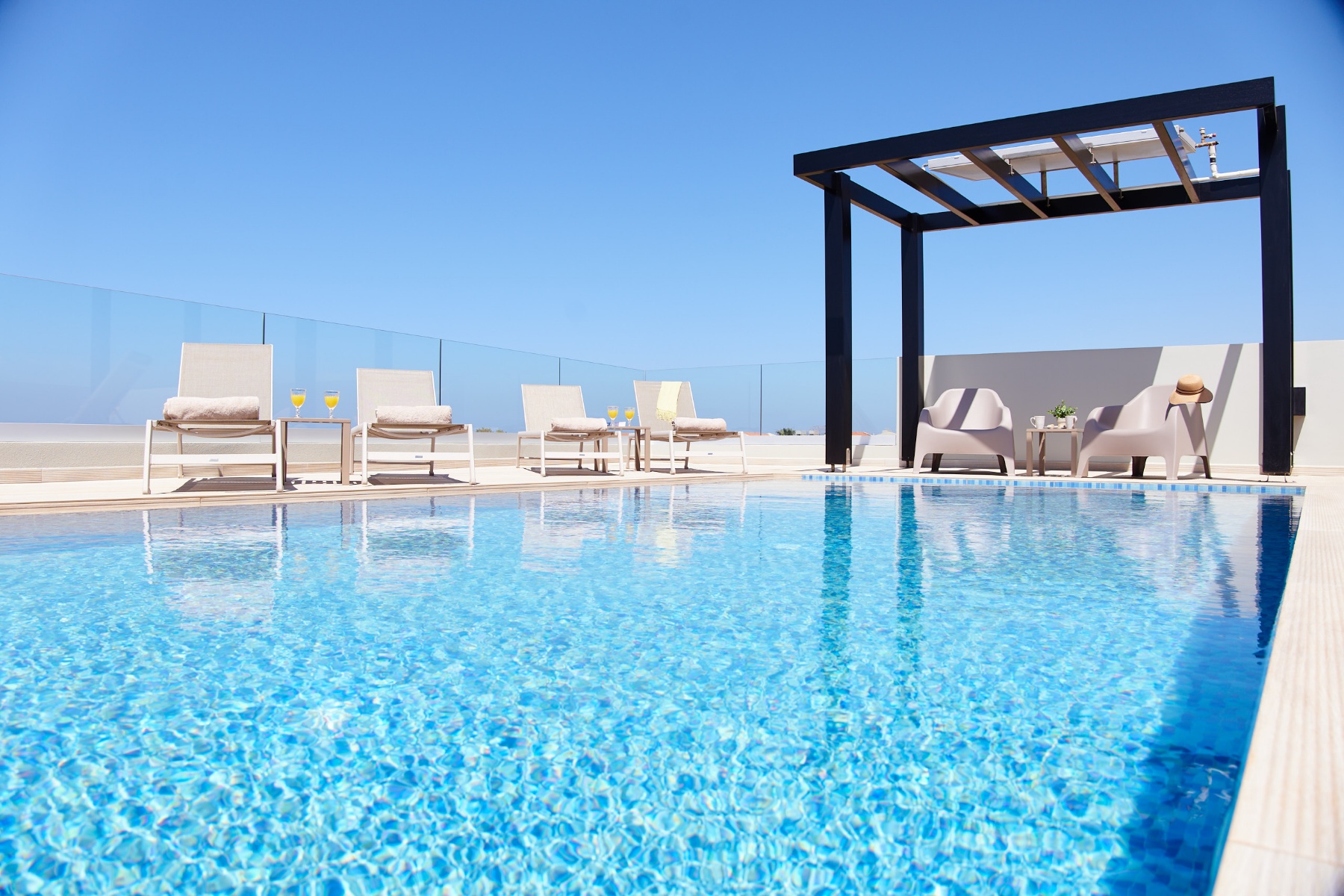 Closeup photo of swimming pool and pergola